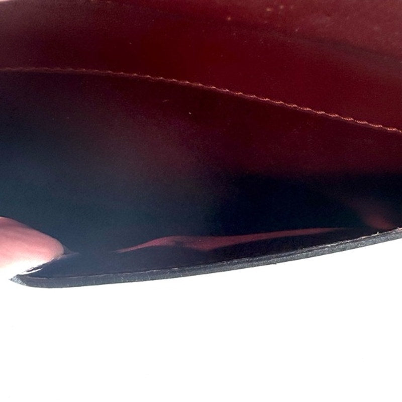 Cartier Burgundy Wristlet pouch with exterior front pocket w/interior peeling