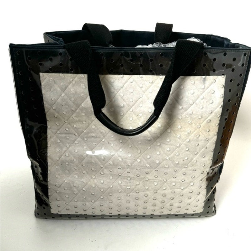 Chanel ENORMOUS tote, black + white fabric w/perforated pvc layer over material